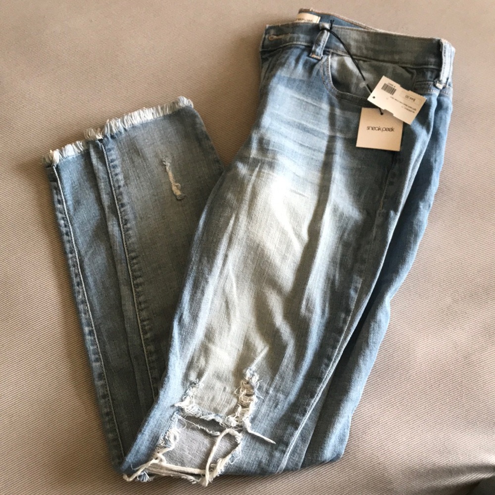Light wash destructed knee denim